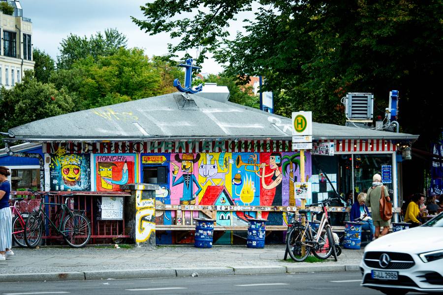 Street side with mural and the anchor on the roof